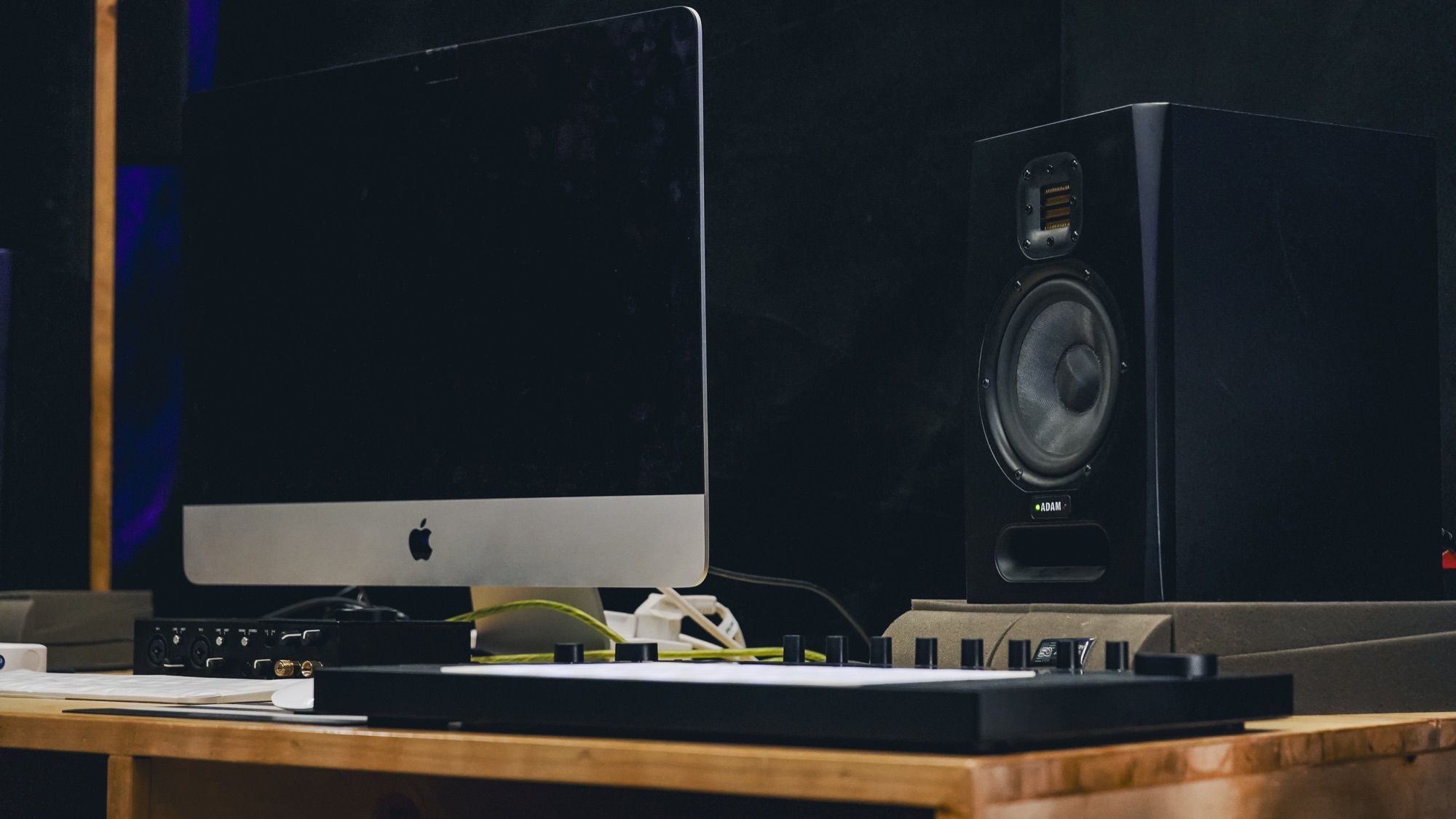Music production workstation with monitor, speakers and controller